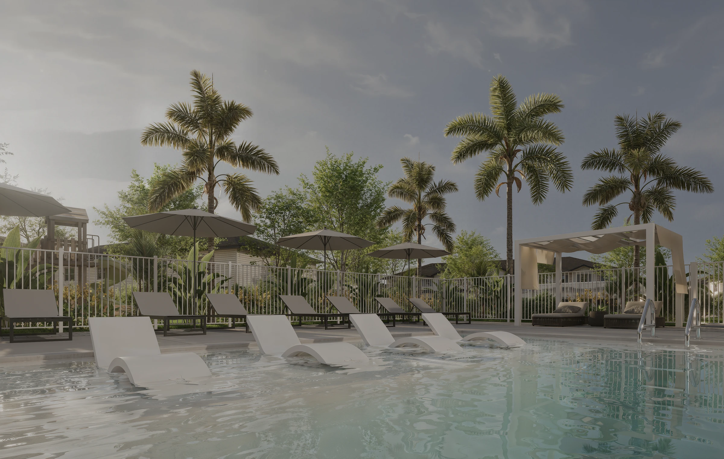 Palm trees and loungers around the Aurora Oaks swimming pool.
